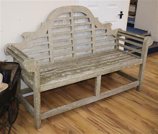 A Lutyens style teak garden bench W.166cm